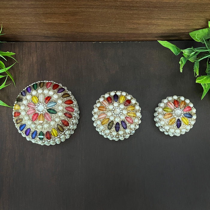 Luxury festival and wedding gift sindoor box set with intricate pearl and colorful bead design.