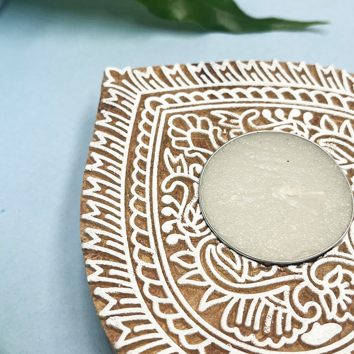Leaf-shaped wooden tea light holders for spiritual ambiance