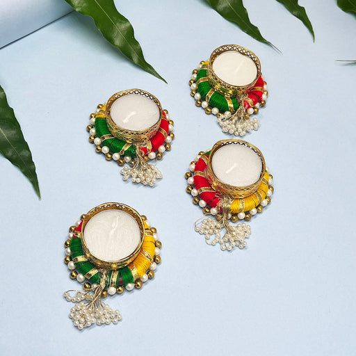 Decorative candle holders set with vibrant thread and pearl work