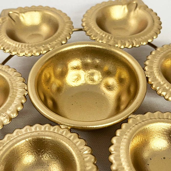 Elevate your Diwali celebrations with this exquisite metal diya urli